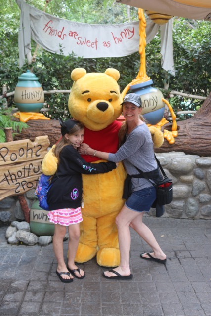 LeeAnn with her daughter, Adaline, and her favorite childhood storybook character, Winnie-the-Pooh